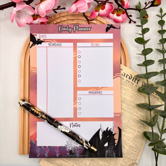 Fighting Dragons – Daily Planner Pad with Black Dragon & Orange Sky | 50 Pages - Stationery Passion